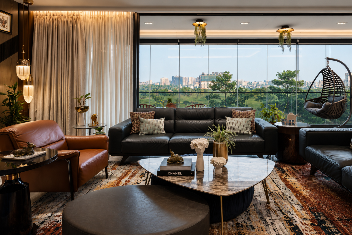 Elements Residence living room with custom leather seating, marble coffee table and panoramic city views