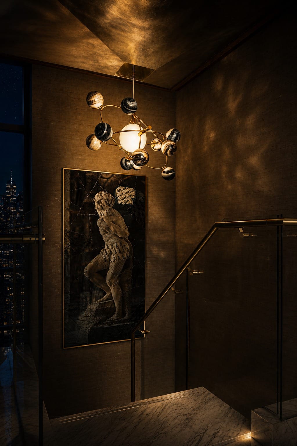 Moody interior staircase with sculptural pendant light, artwork and dark textured walls